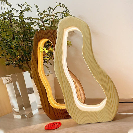 Hollow design, LED glow, wooden charm, simple style desktop lamp.